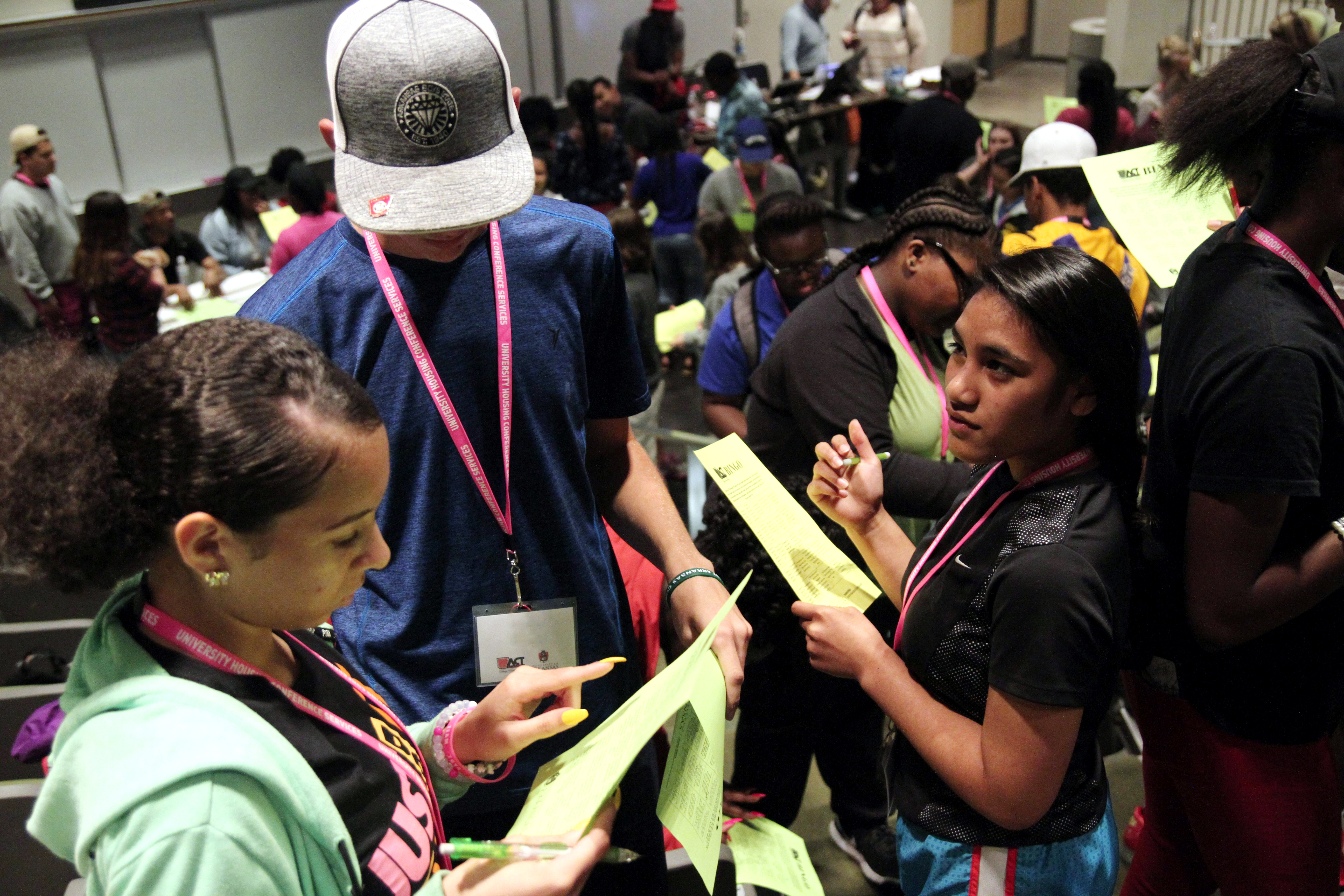 Students participating in the ACT Academy summer session talk to each other during a class exercise.