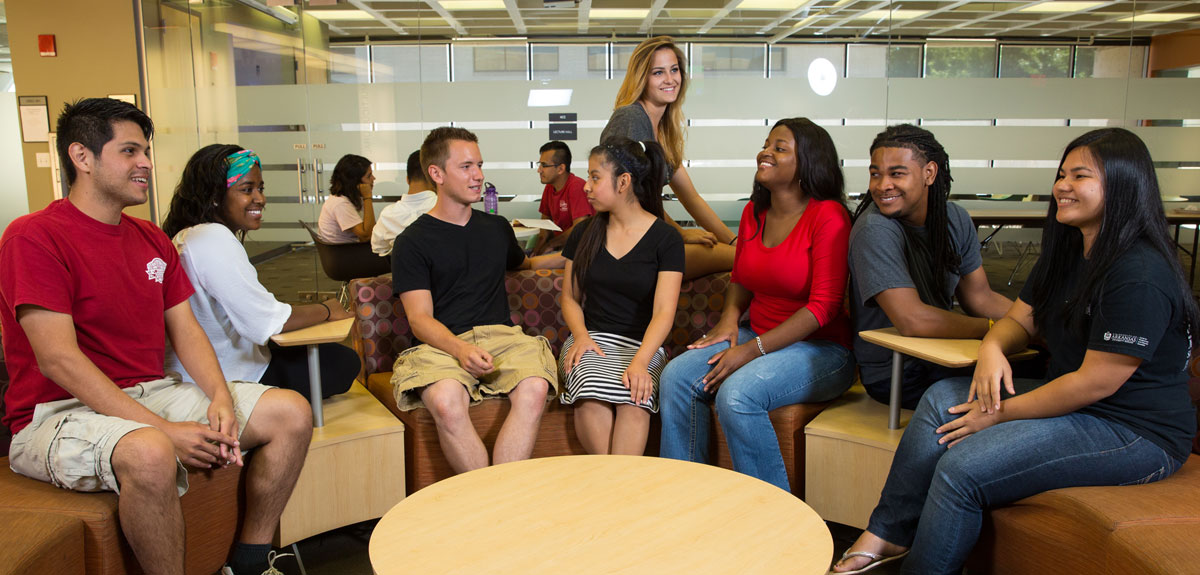 Students conversing in the Multicultural Center at the University of Arkansas